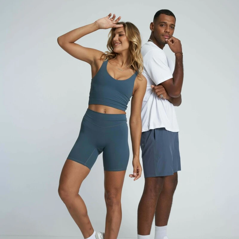 Man and woman dressed in gym outfits