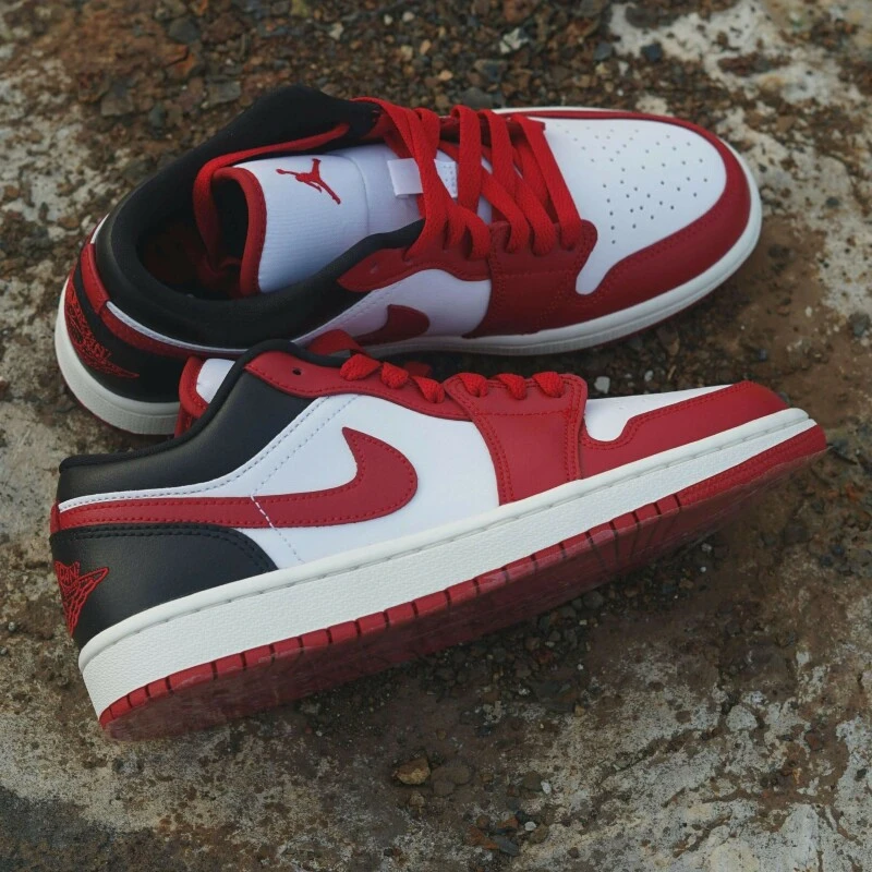A pair of red, white and black trainers with the Nike logo